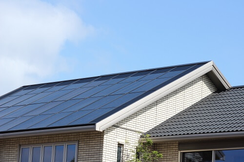 Home with solar roofing panels