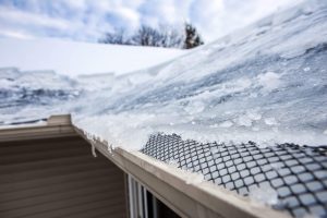 up close picture of a roof with snow and ice