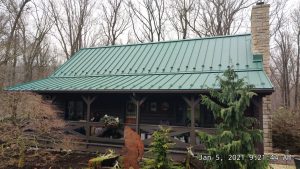 Green standing seam roof on a house