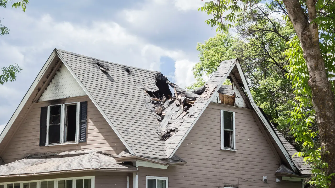 A roof with fire damage in Lancaster County, PA, by Joyland Roofing.