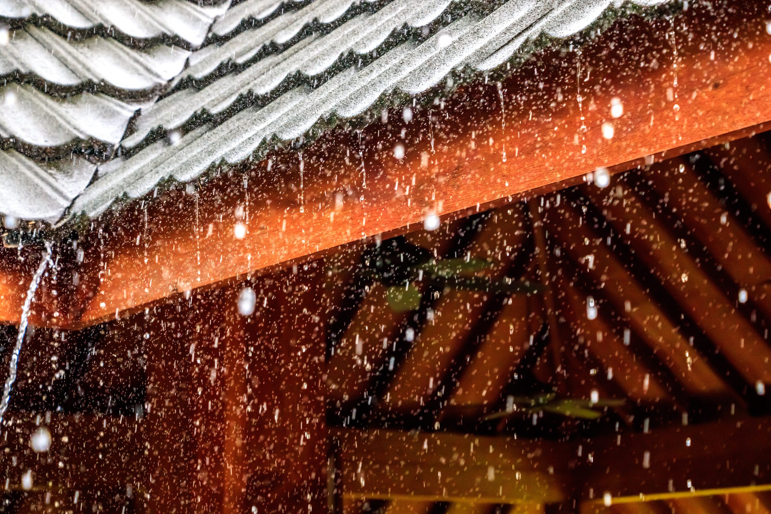 Metal and cedar roof with heavy rain